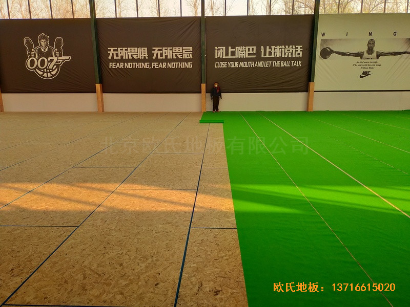 山東北環路平安行駕校籃球館體育木地板施工案例3